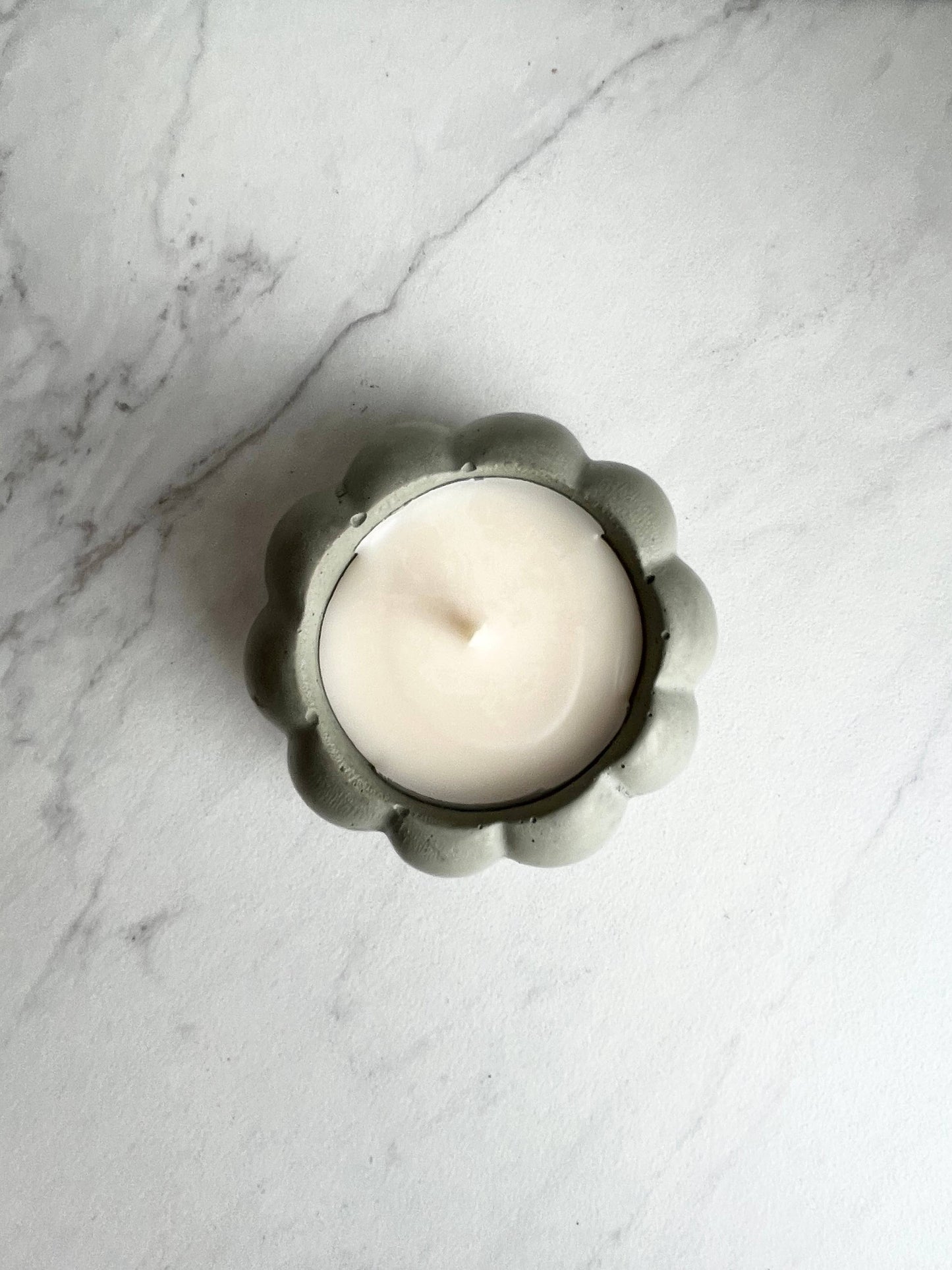 Concrete pumpkin candle