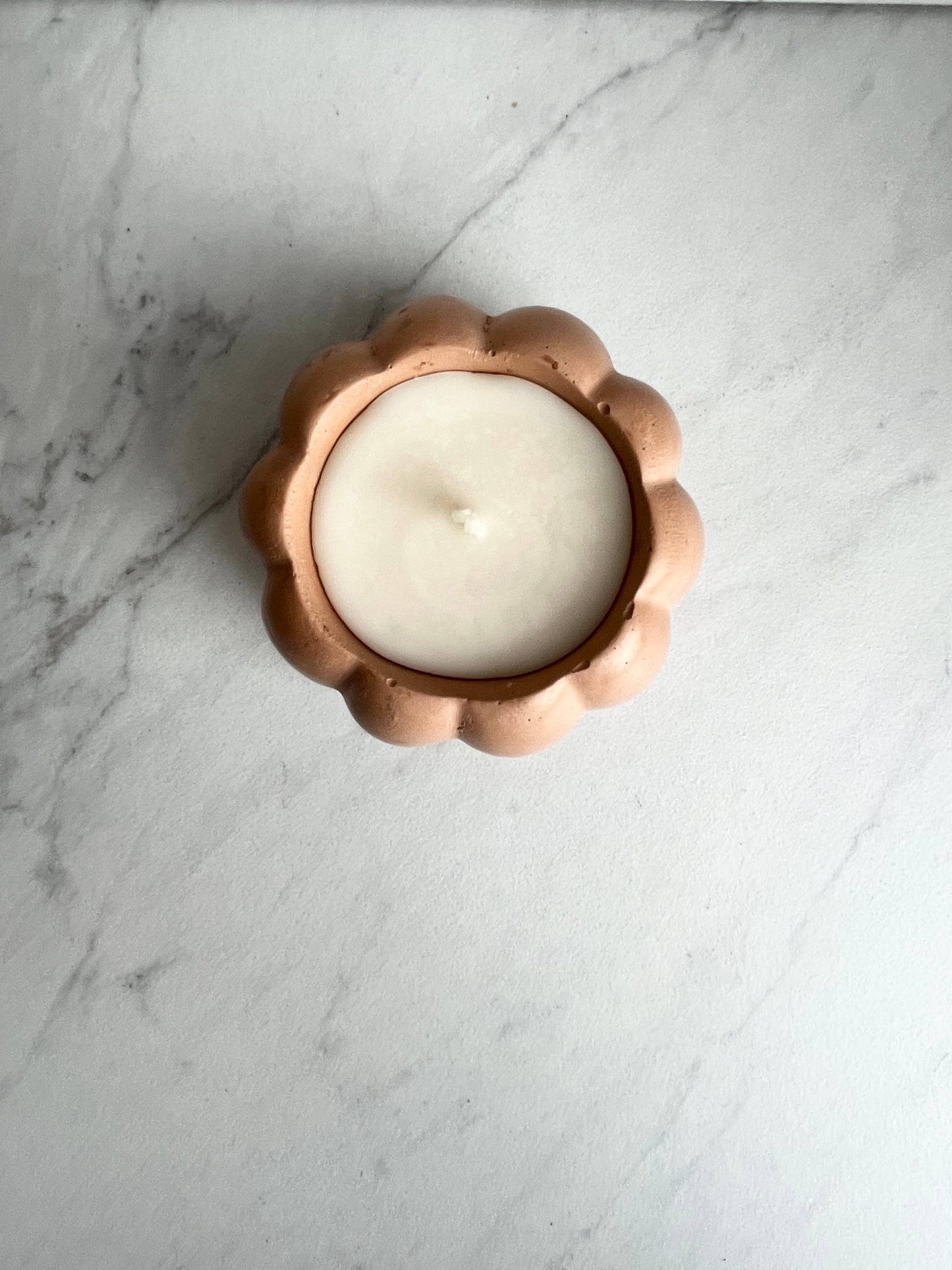 Concrete pumpkin candle