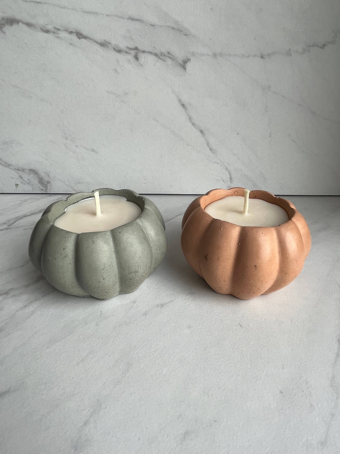 Concrete pumpkin candle